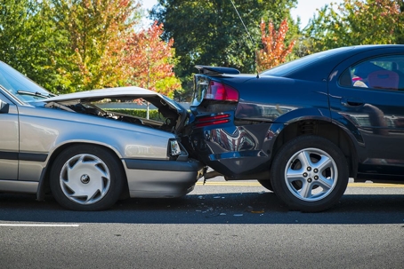 Two Cars in an accident one striking the rear of the other car with a lot of damage